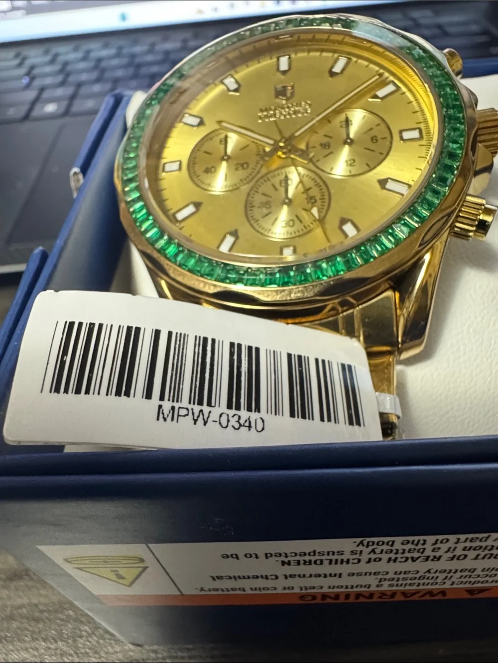 Gold Chronograph Watch with Green Bezel